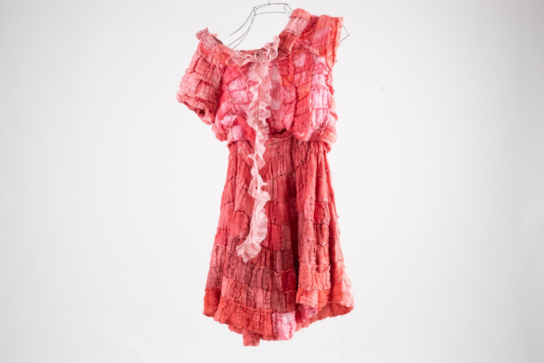 Dress made of dyed medical gauze and lace, from I know you’re leaving soon, by Enya Santamaría
